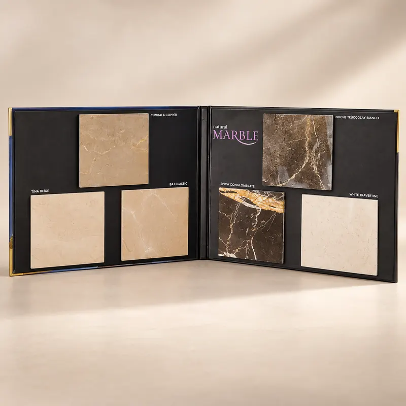 Open swatch book with six stone tiles mounted on black recessed board panels